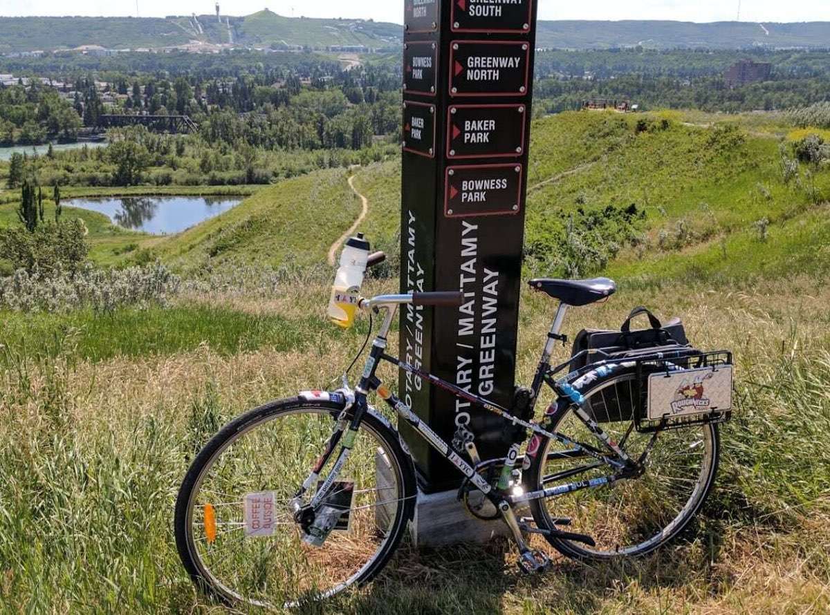 The Calgary Greenway bike trail sign on sunny day