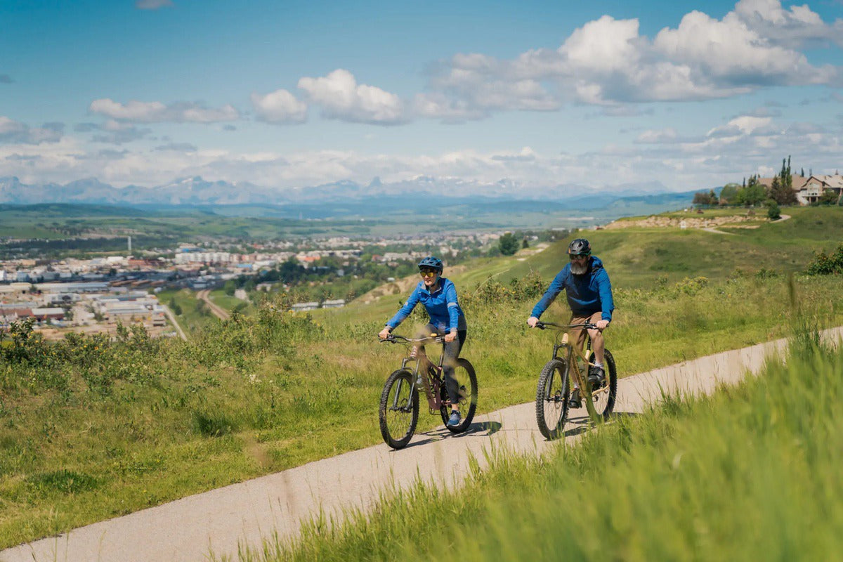 Two people biking the Glenbow Ranch pathway from Calgary