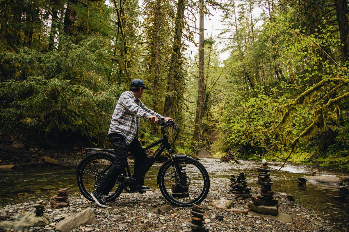 Man riding Colt eBike in wilderness between Banff and Canmore
