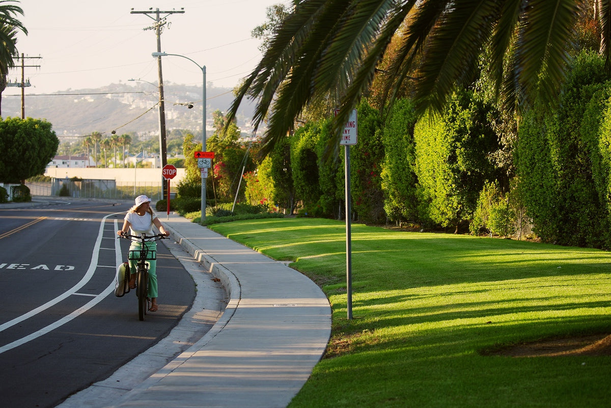 Commuter eBike by Surface604 being ridden by woman down city road