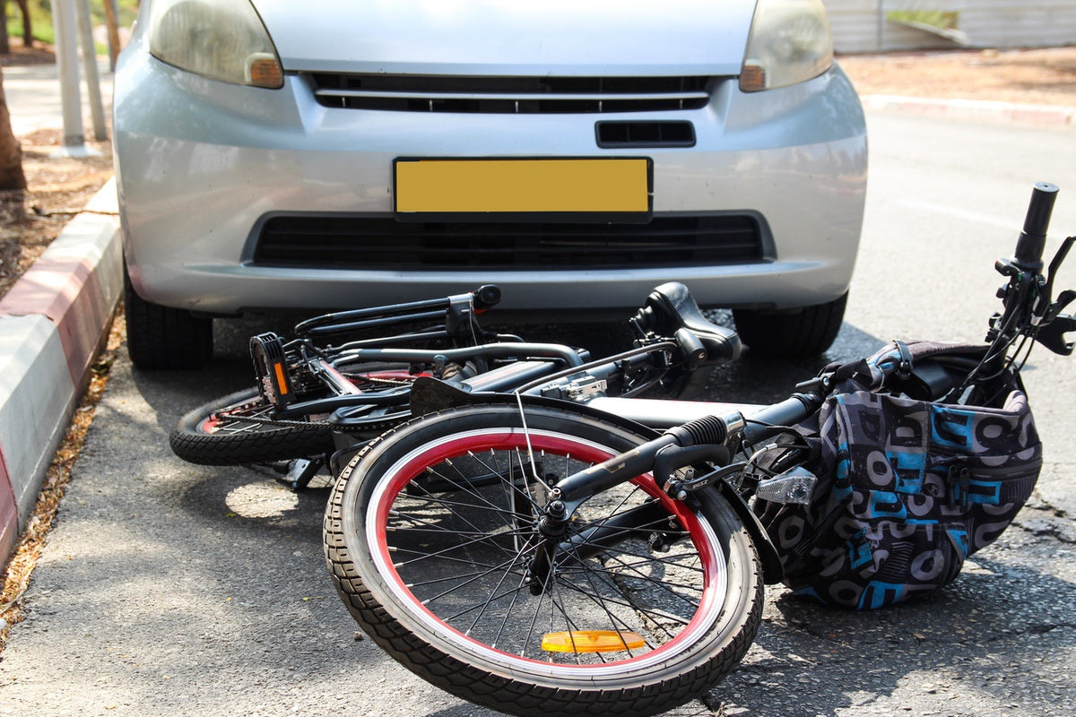 eBike knocked over by car as the result of being in blind spot